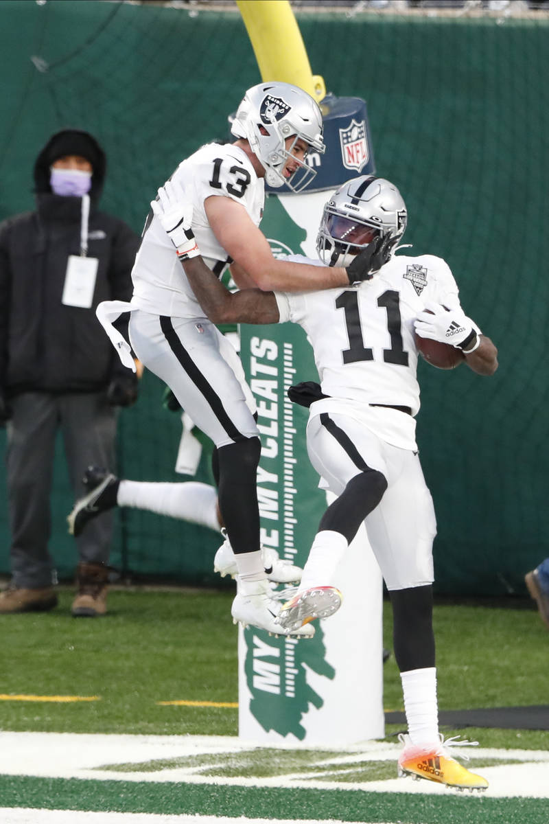 Las Vegas Raiders' Henry Ruggs III, right, celebrates his touchdown with Hunter Renfrow during ...