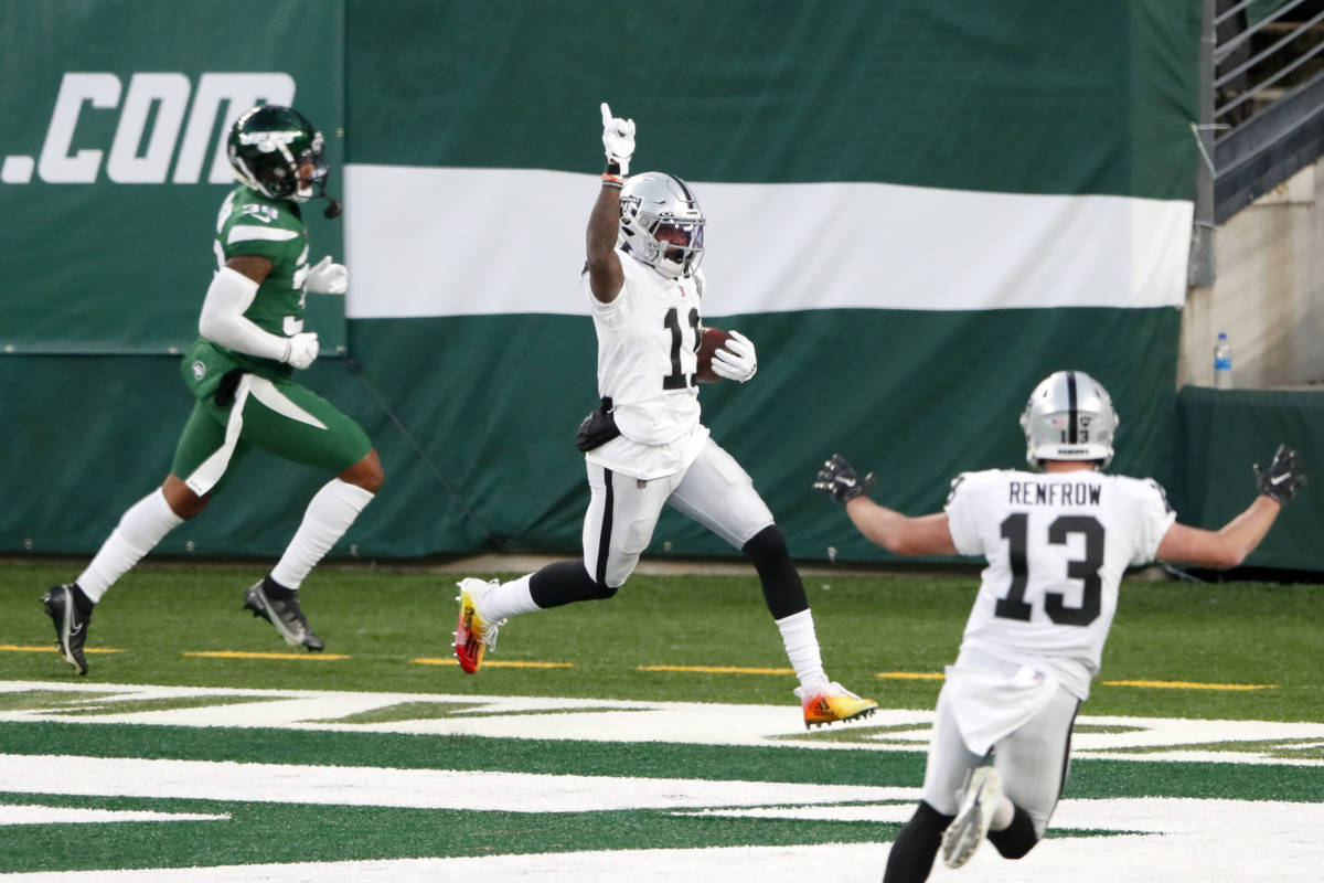 Las Vegas Raiders' Henry Ruggs III, center, celebrates his touchdown during the second half an ...