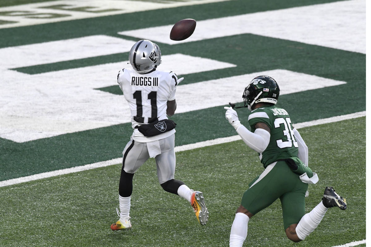 Las Vegas Raiders' Henry Ruggs III, left, catches a touchdown during the second half an NFL foo ...