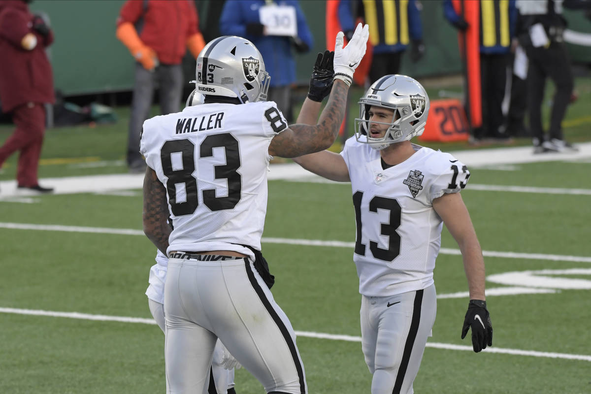 Las Vegas Raiders' Darren Waller, left, celebrates his touchdown with Hunter Renfrow during the ...