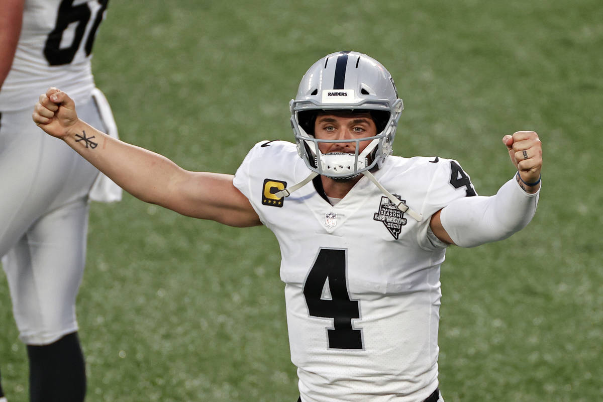 Las Vegas Raiders quarterback Derek Carr (4) reacts after throwing a game winning touchdown pas ...