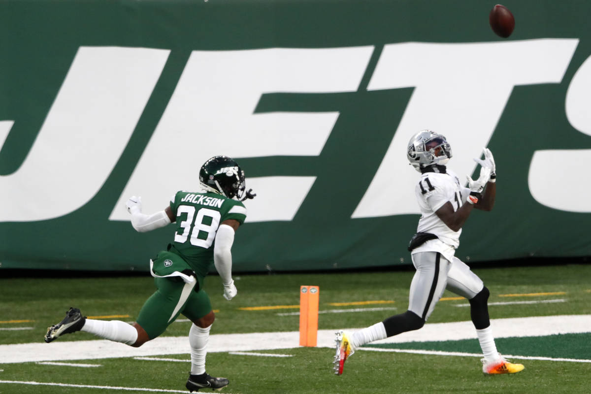 Las Vegas Raiders' Henry Ruggs III, right, catches a touchdown during the second half an NFL fo ...