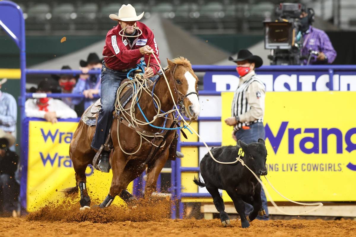 Adam Gray rides during the 4th go-round of the National Finals Rodeo in Arlington, Texas, on Su ...