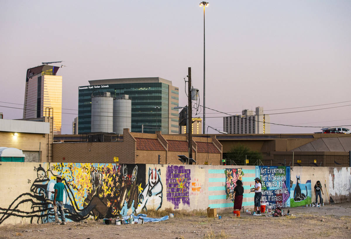 Artists work on murals at the site of the former Moulin Rouge in Las Vegas on Saturday, Oct. 3, ...