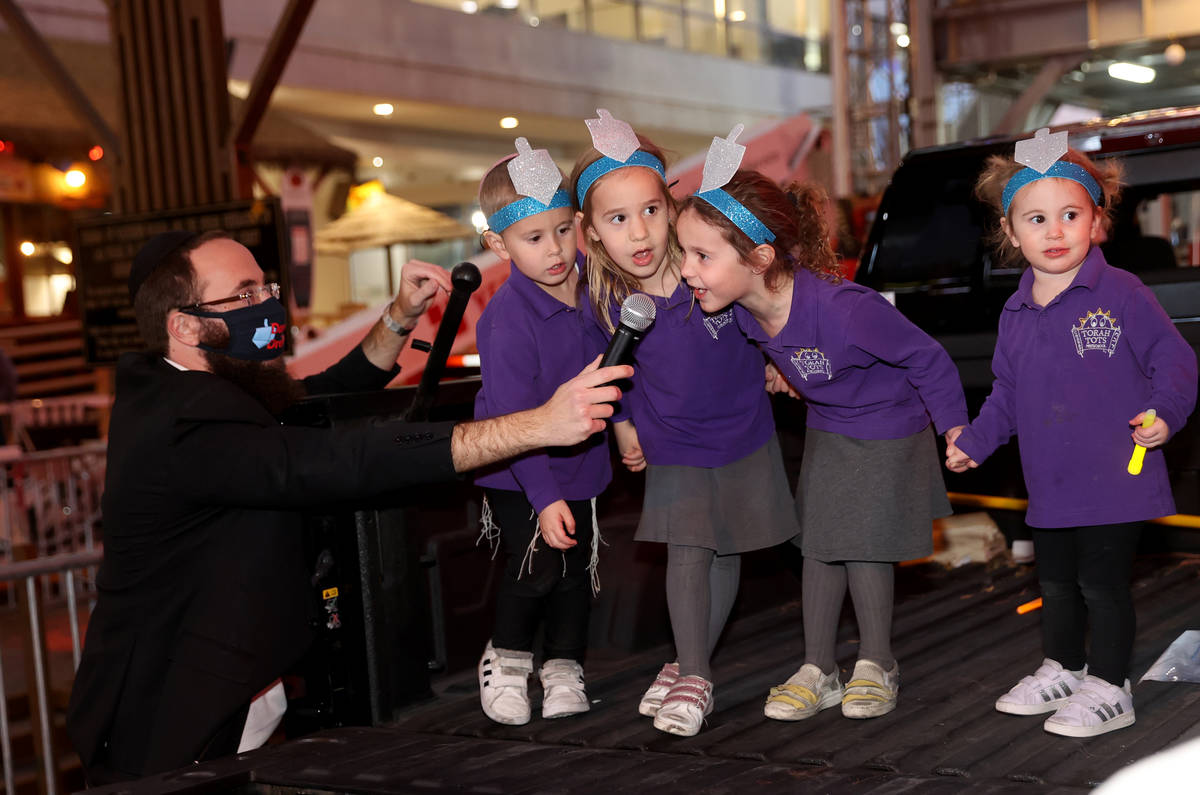 Members of the Torah Tots Preschool choir, from left, Mendel Harlig, 3, Rivka Harlig, 4, Mussie ...