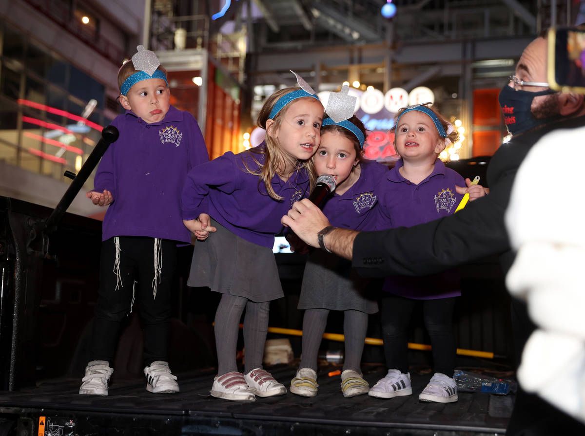 Members of the Torah Tots Preschool choir, from left, Mendel Harlig, 3, Rivka Harlig, 4, Mussie ...