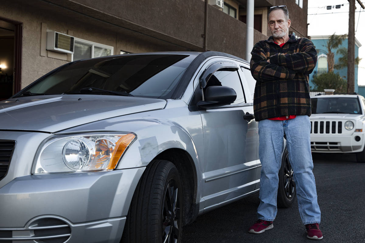 Thomas Elgas next to his car outside his home in Las Vegas, Tuesday, Dec. 1, 2020. Elgas might ...