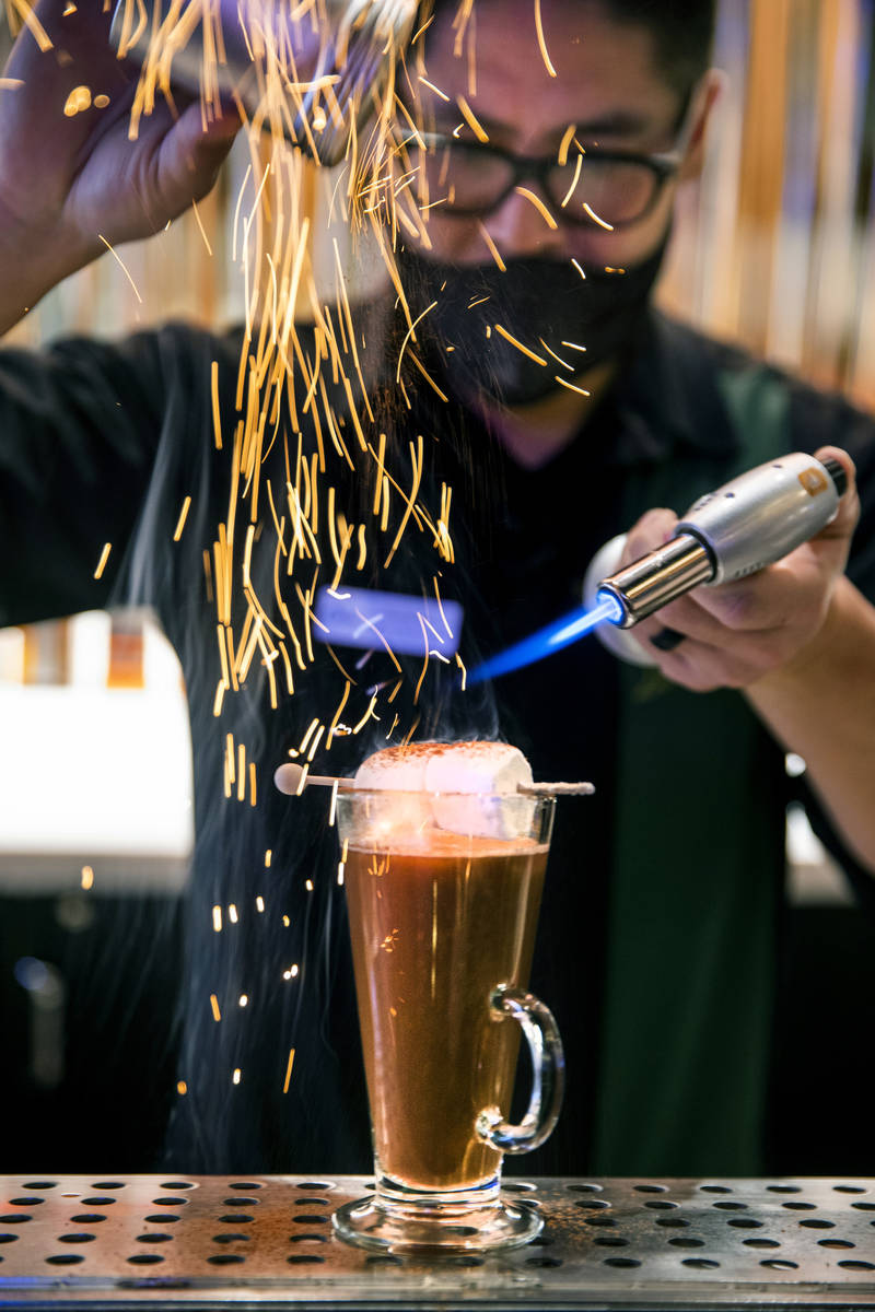 Bartender Anthony Wu prepares a Campfire Hot Chocolate at Vegas Vickie's Cocktail Lounge in the ...