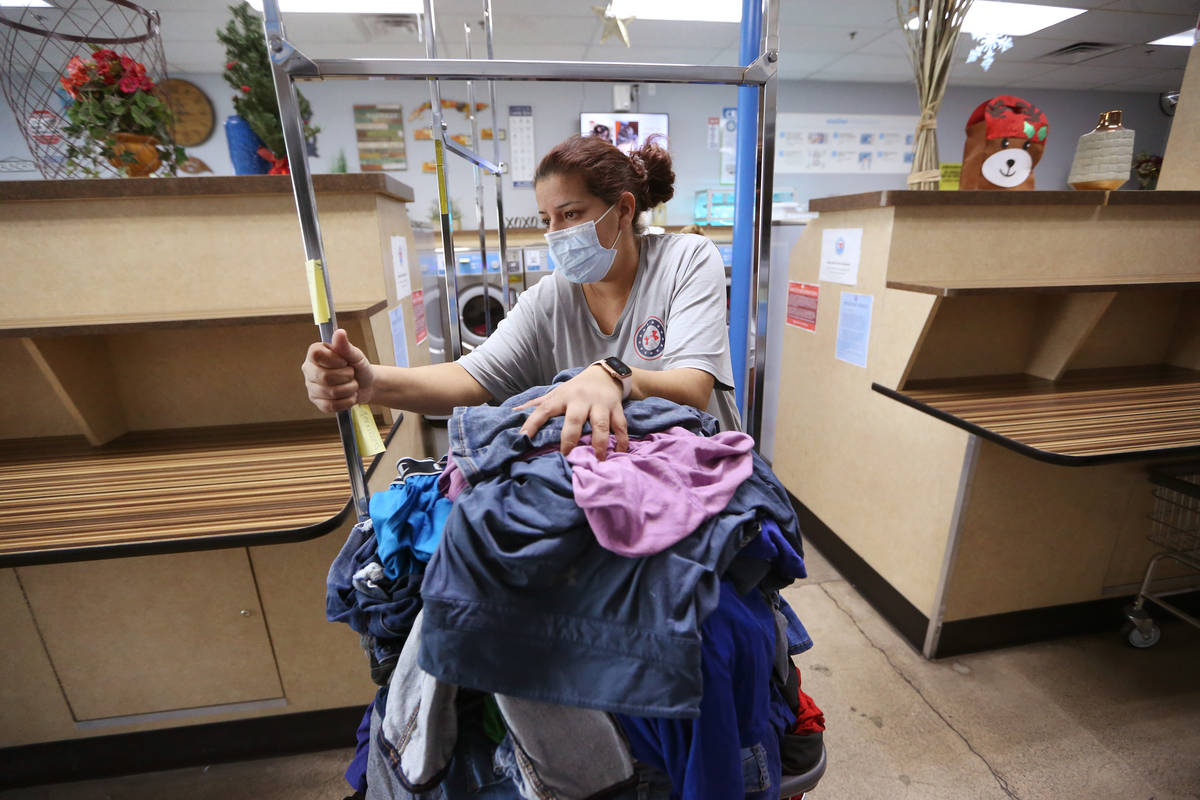 Vanessa Gutierrez of Las Vegas does her laundry free of charge as part of the Laundry Project b ...