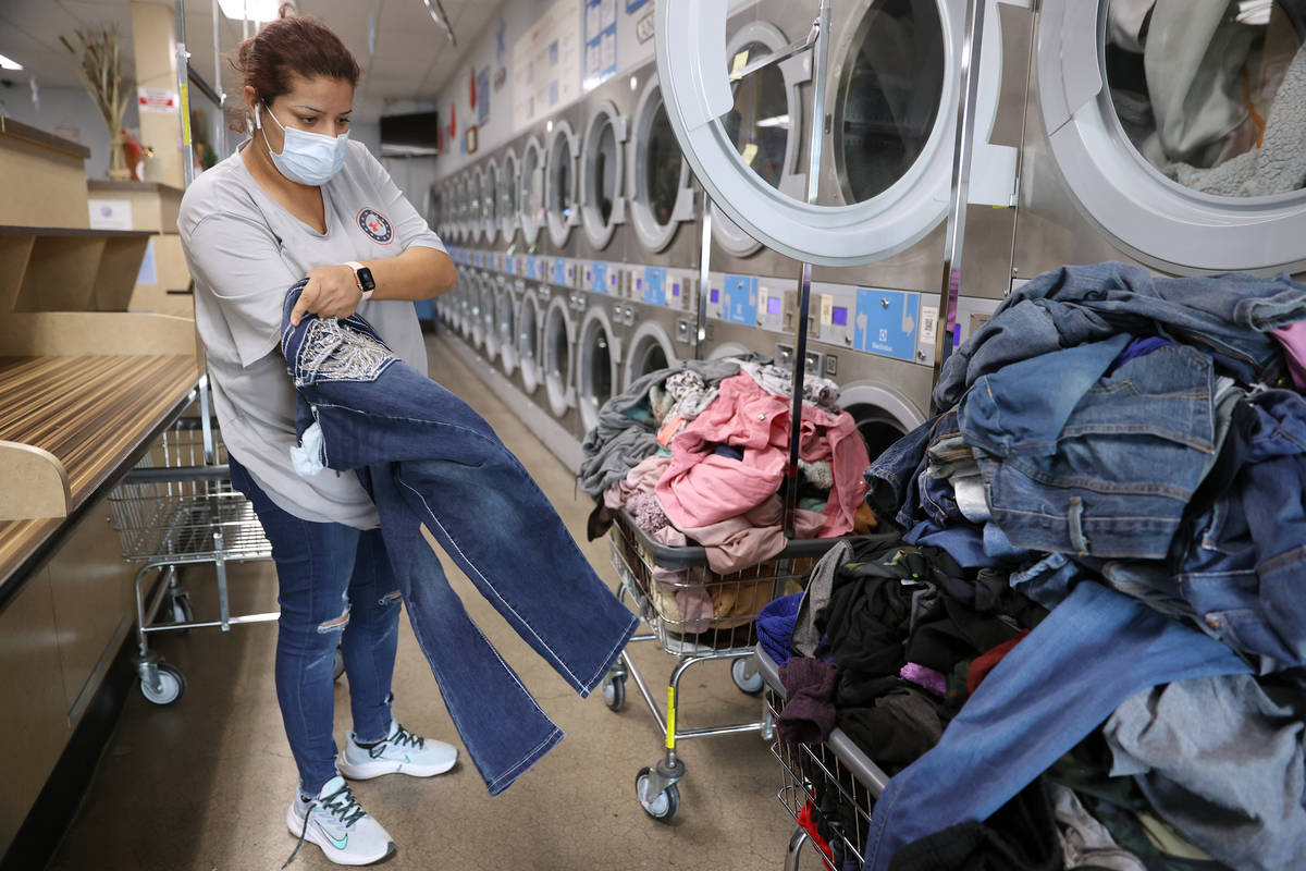 Vanessa Gutierrez of Las Vegas does her laundry free of charge as part of the Laundry Project b ...