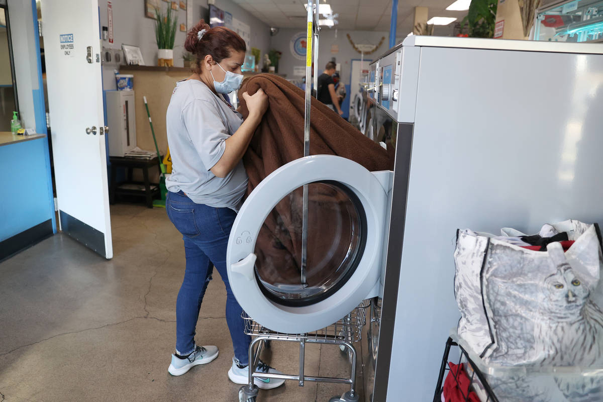 Vanessa Gutierrez of Las Vegas does her laundry free of charge as part of the Laundry Project b ...