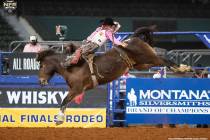 Clayton Biglow performs during the fifth go-round of the National Finals Rodeo in Arlington, Te ...