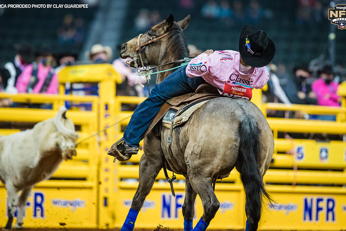 Junior Nogueira performs during the fifth go-round of the National Finals Rodeo in Arlington, T ...