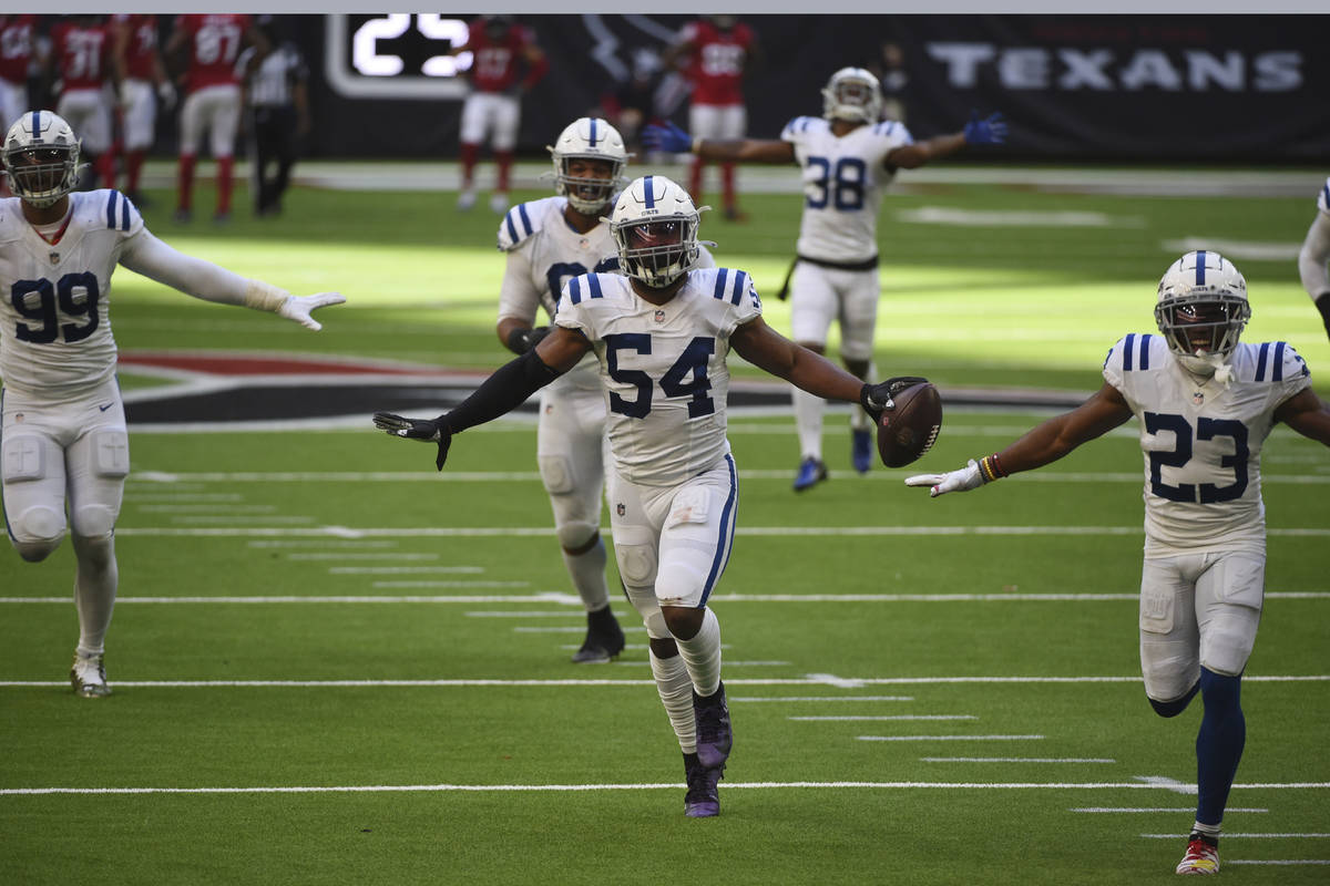 Indianapolis Colts middle linebacker Anthony Walker (54) celebrates with teammates after he rec ...