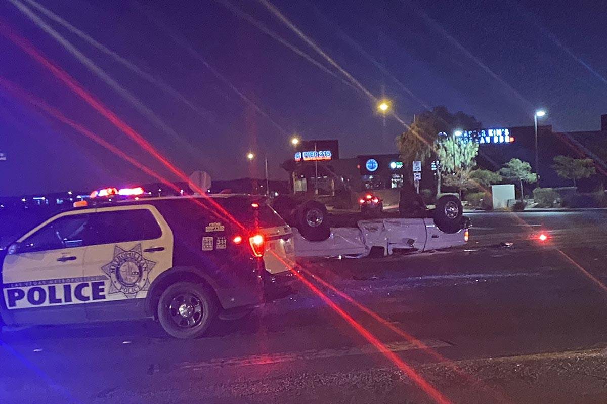 A white pickup was flipped in a collision at South Durango Drive and the 215 Beltway on Tuesday ...