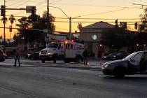 Crews work to remove a downed light pole at East Flamingo and South Sandhill roads on Tuesday, ...