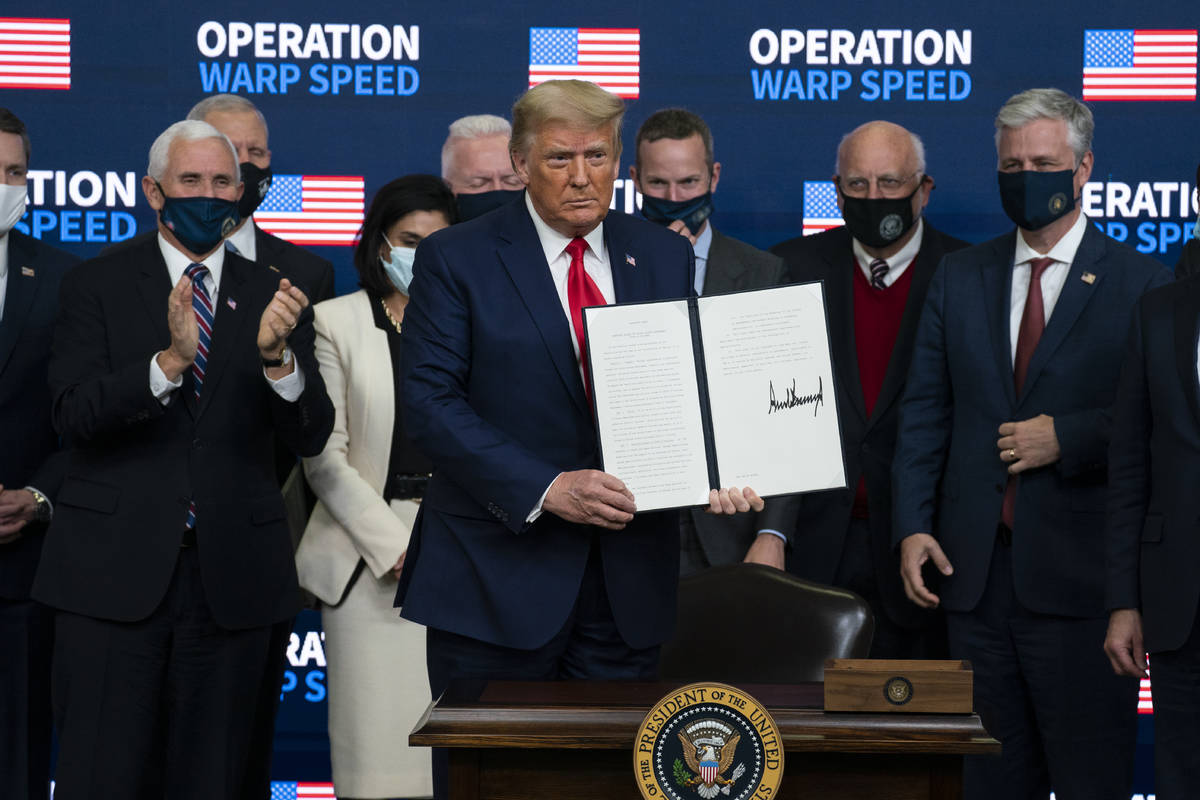 President Donald Trump shows an executive order on vaccine distribution during an "Operati ...