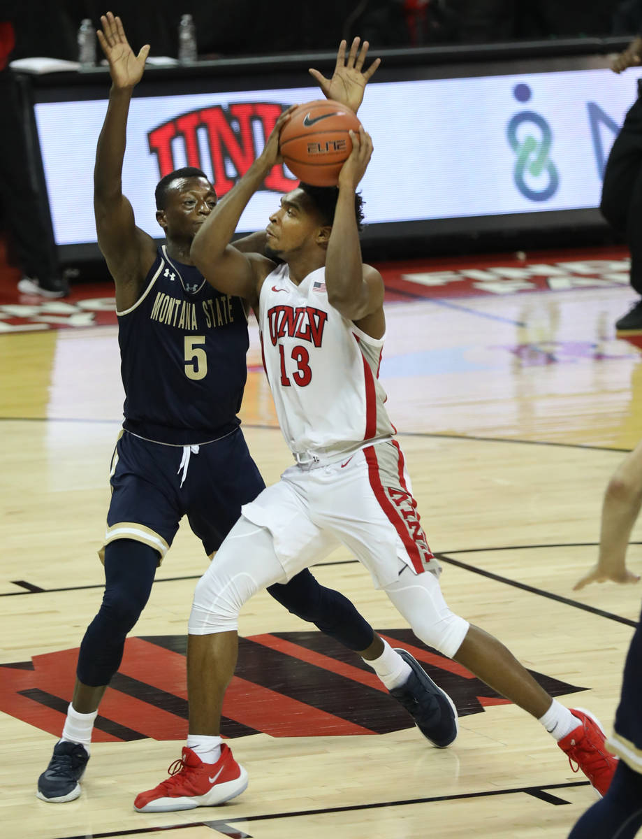 UNLV Rebels guard Bryce Hamilton (13) is pressured by Montana State Bobcats guard Amin Adamu (5 ...