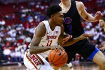 UNLV Rebels' Bryce Hamilton (13) drives to the basket against Boise State Broncos' Justinian Je ...