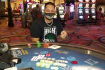 Rafael Valentin of Louisville, Ky., grins under his mask after celebrating his Blazing 7’s ja ...