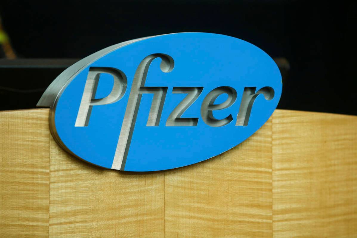 FILE - In this file photo dated Wednesday, July 22, 2020, a Pfizer sign is seen on a podium at ...