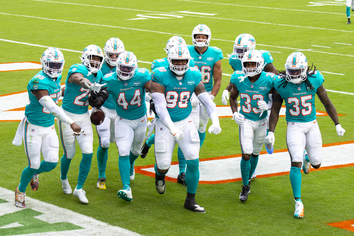 Miami Dolphins cornerback Xavien Howard (25) celebrates intercepting a pass intended for Cincin ...