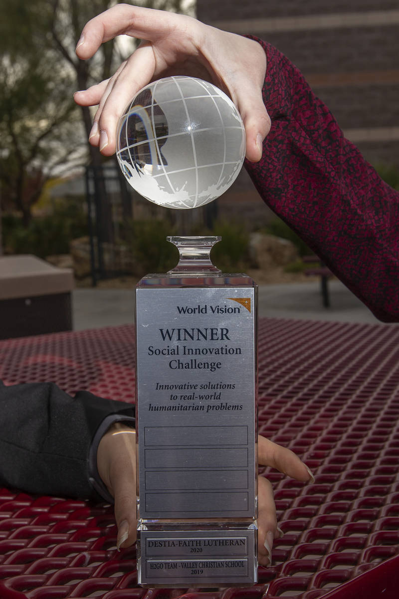 Student winners Mason DeVore and McKenna Erwin holed their trophy for winning the World Vision ...