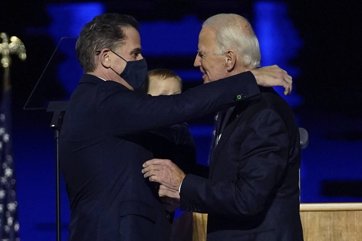 In this Nov. 7, 2020, file photo, President-elect Joe Biden, right, embraces his son Hunter Bid ...