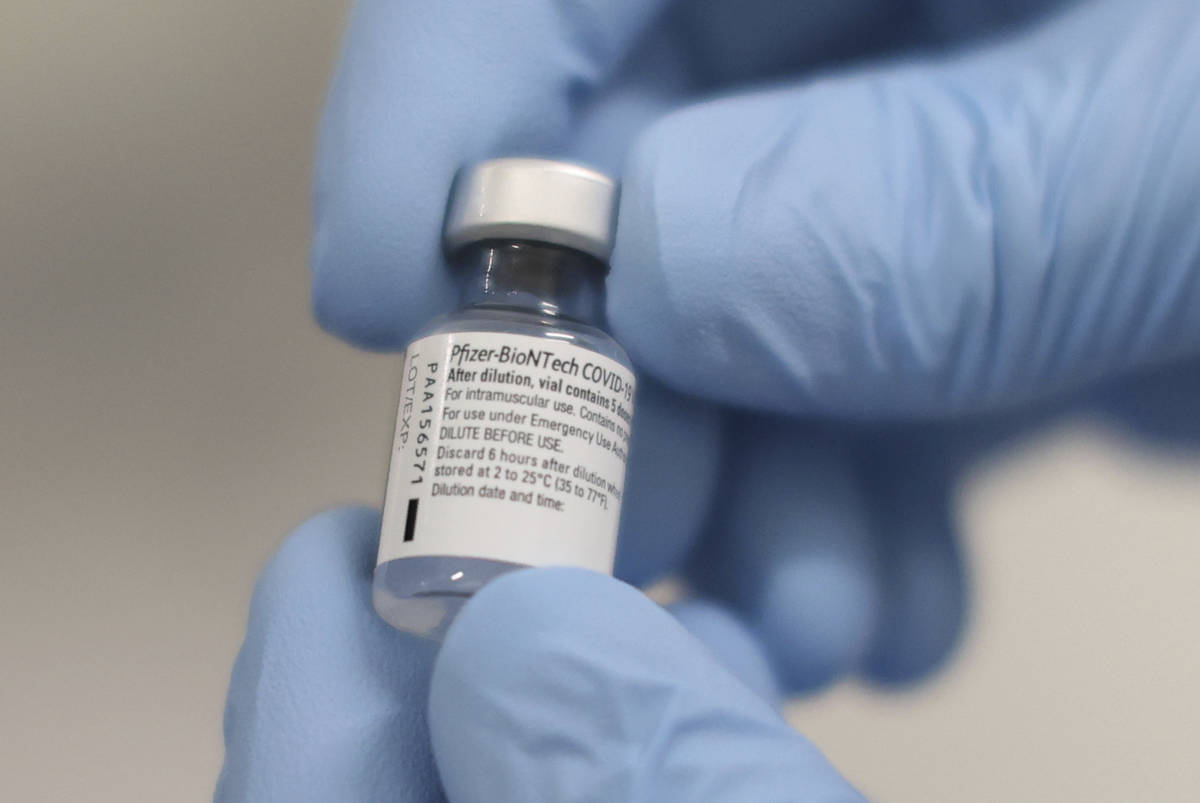 A phial of the Pfizer-BioNTech COVID-19 vaccine at the Royal Victoria Hospital, in Belfast, Tue ...