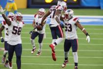 New England Patriots cornerback J.C. Jackson (27) celebrates his interception with New England ...