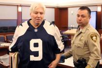 Thomas Randolph, wearing Tony Romo jersey, leaves the courtroom after appearing in his death pe ...