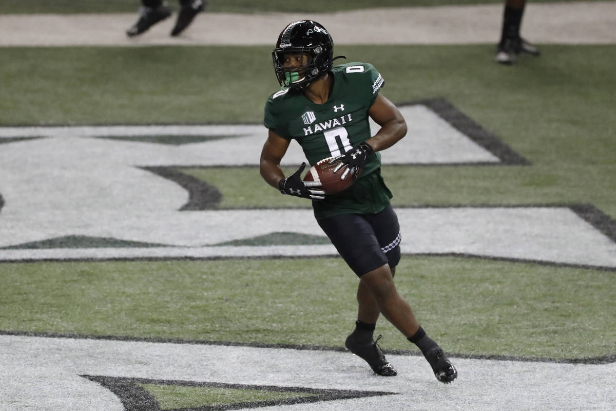Hawaii running back Dae Dae Hunter turns after scoring a touchdown against UNLV during the firs ...