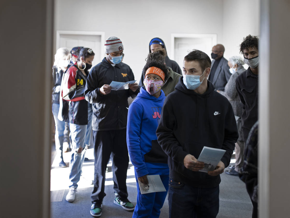 Family and friends wait to sign in during a memorial service for Genesis Atkins on Saturday, De ...