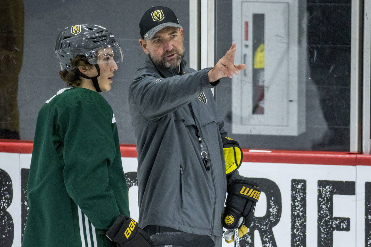 In this July 23, 2020, file photo, Vegas Golden Knights head coach Peter DeBoer, right, talks ...