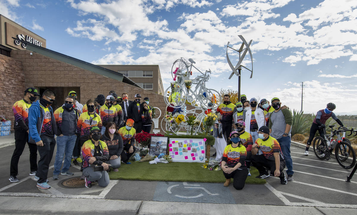 Members of the Nevada Bicycle Club gather during a vigil honoring the lives of five Las Vegas c ...