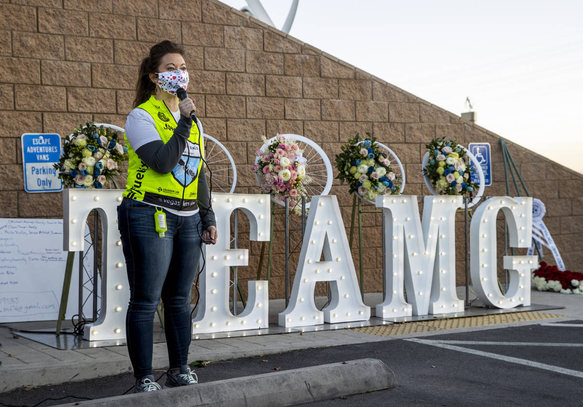 Shelly White, a co-founder of Ghost Bikes, dresses the attendees during a vigil honoring the li ...