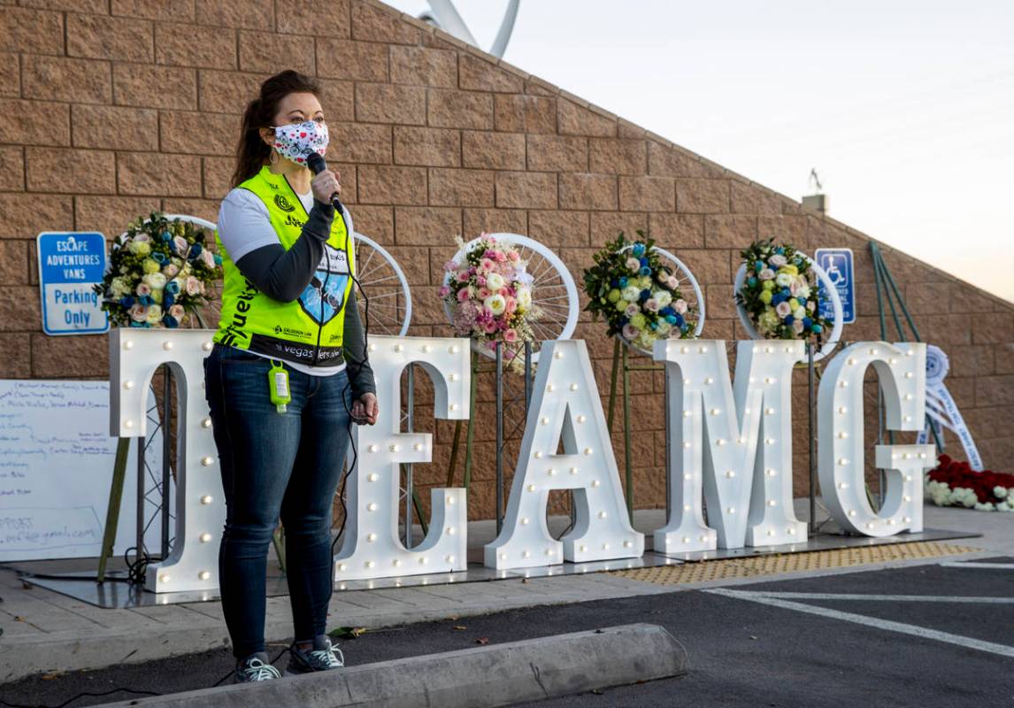 Shelly White, a co-founder of Ghost Bikes, dresses the attendees during a vigil honoring the li ...