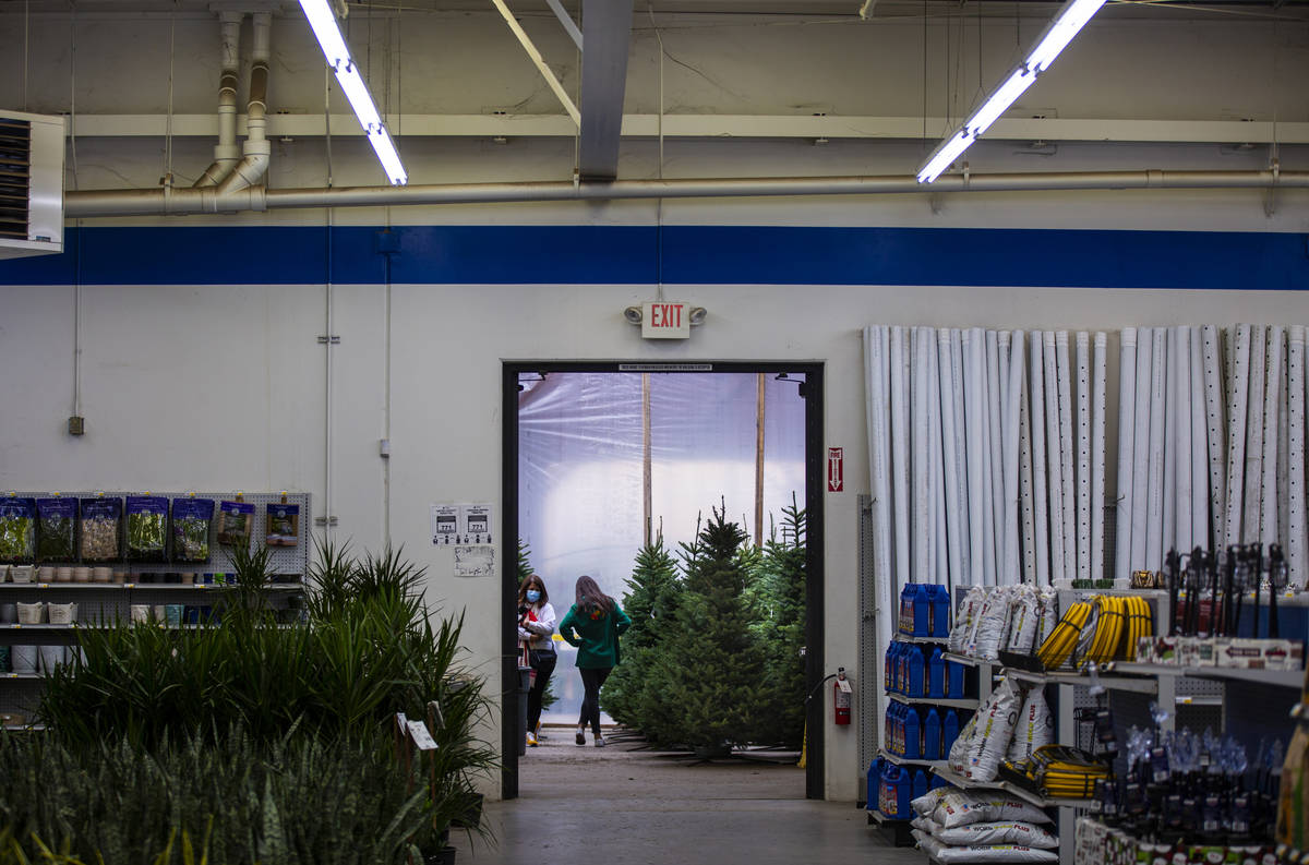 Lisa Chatham, left, and her daughter, Maddy Chatham, shop for a Christmas tree at Star Nursery ...