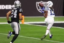 Indianapolis Colts wide receiver T.Y. Hilton (13) makes a touchdown catch under pressure from R ...