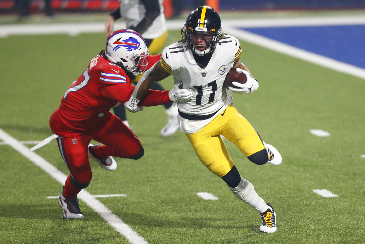 Pittsburgh Steelers wide receiver Chase Claypool (11) gets past Buffalo Bills defensive end Mar ...
