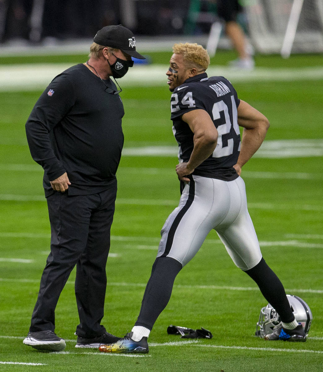 Raiders head coach Jon Gruden talks to Raiders strong safety Johnathan Abram (24) before an NFL ...
