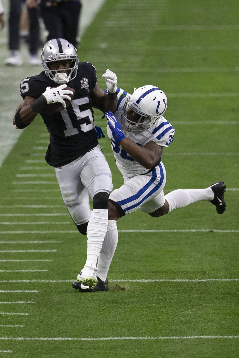 Raiders wide receiver Nelson Agholor (15) makes a catch as Indianapolis Colts cornerback T.J. C ...