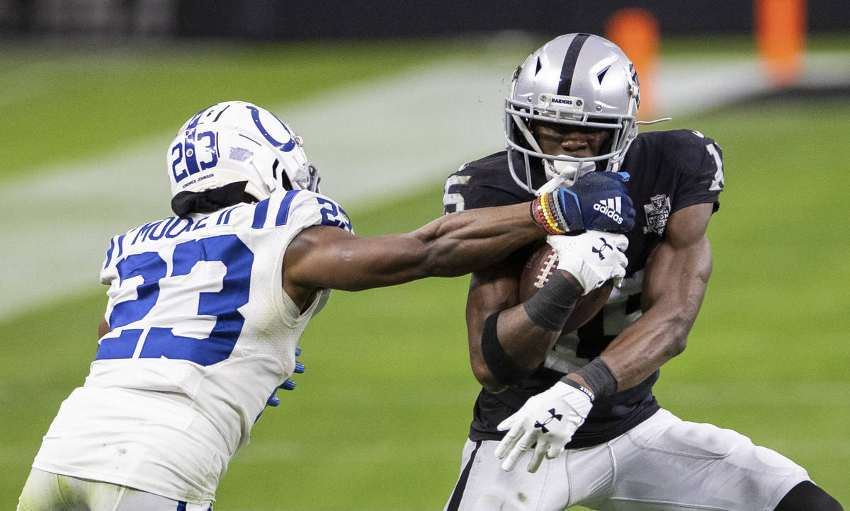 Raiders wide receiver Nelson Agholor (15) fights for extra yardage against Indianapolis Colts c ...