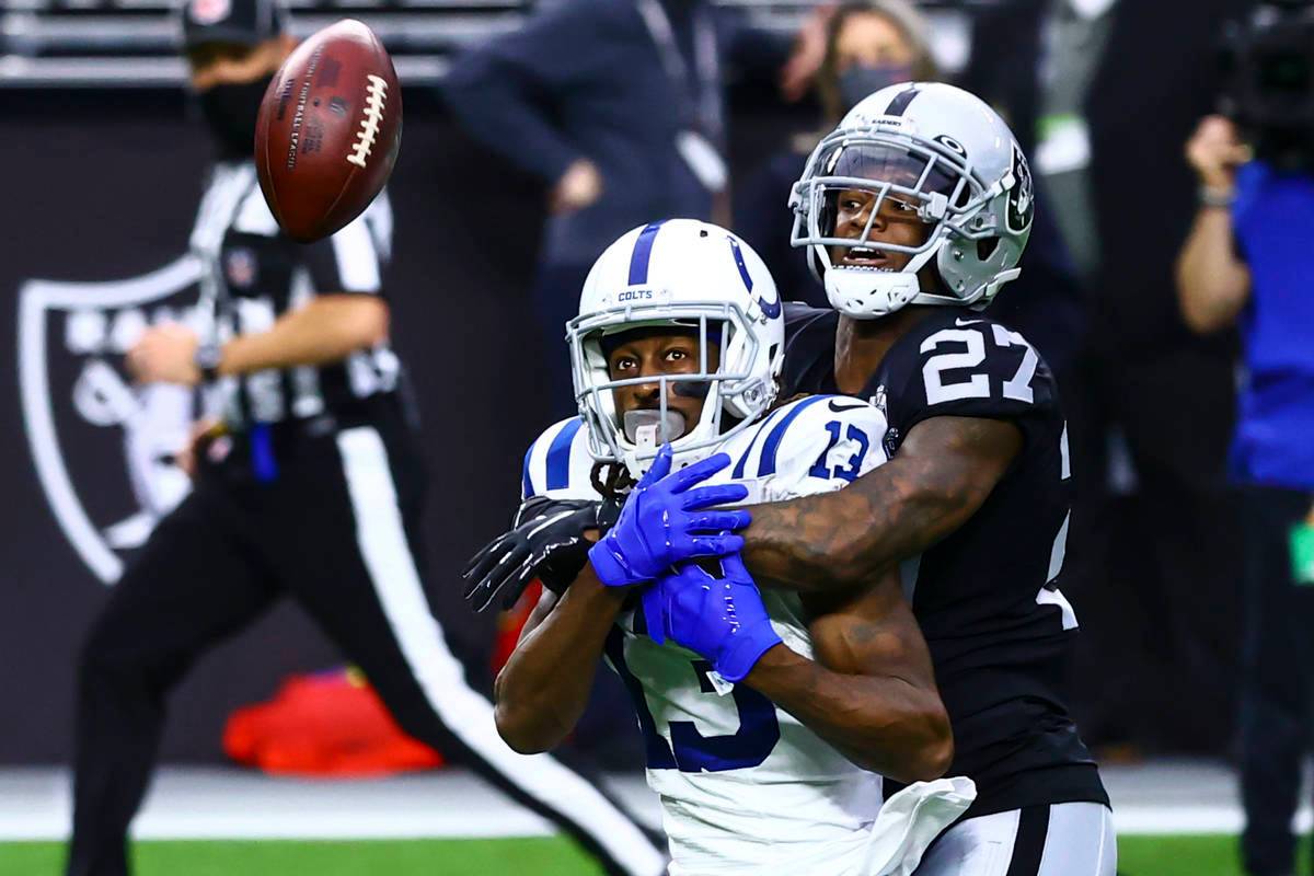 Raiders cornerback Trayvon Mullen (27) breaks up a pass intended for Indianapolis Colts wide re ...