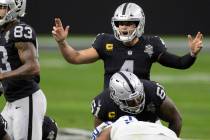 Raiders quarterback Derek Carr (4) calls an audible in the third quarter during an NFL football ...
