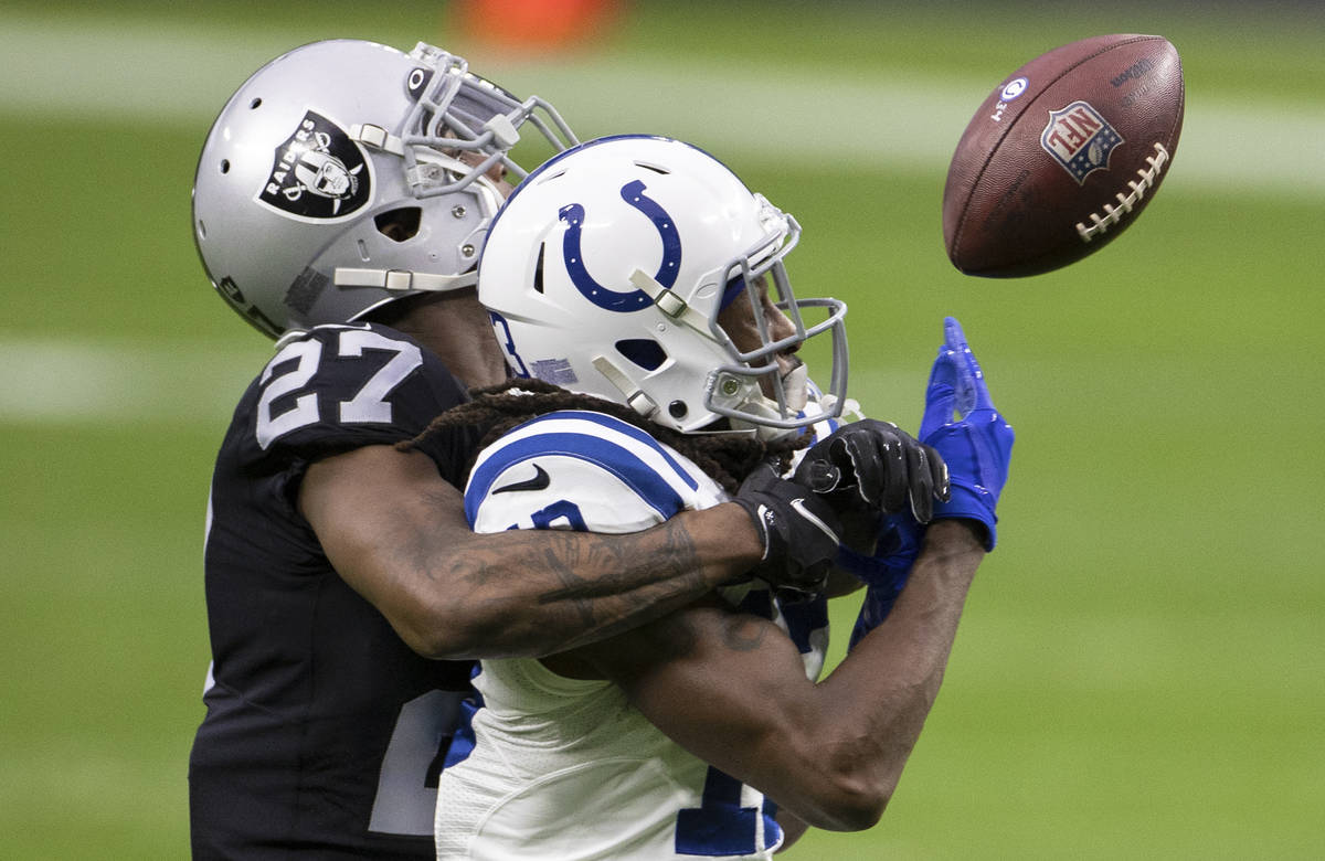 Raiders cornerback Trayvon Mullen (27) breaks up a pass intended for Indianapolis Colts wide re ...