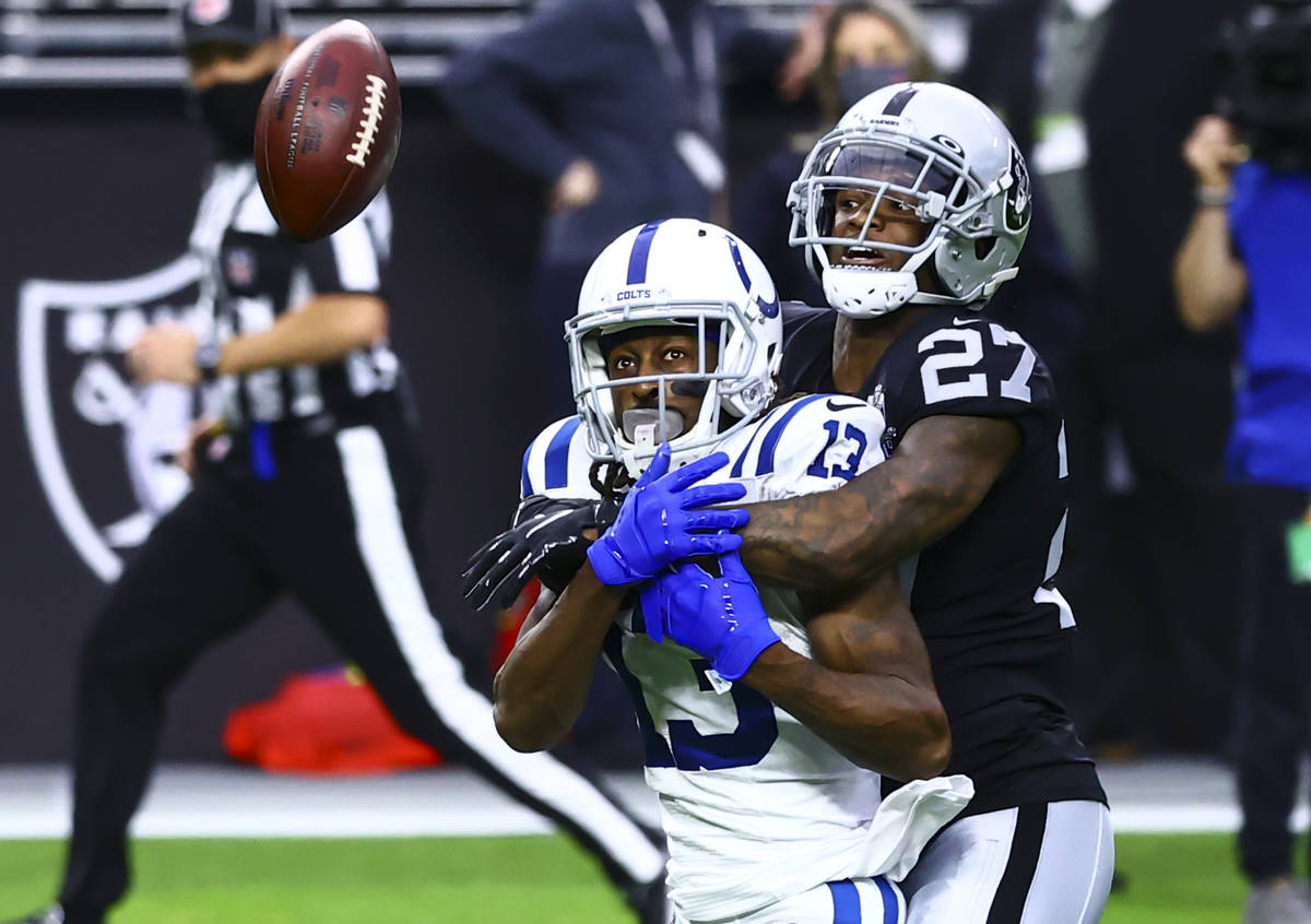 Raiders cornerback Trayvon Mullen (27) breaks up a pass intended for Indianapolis Colts wide re ...