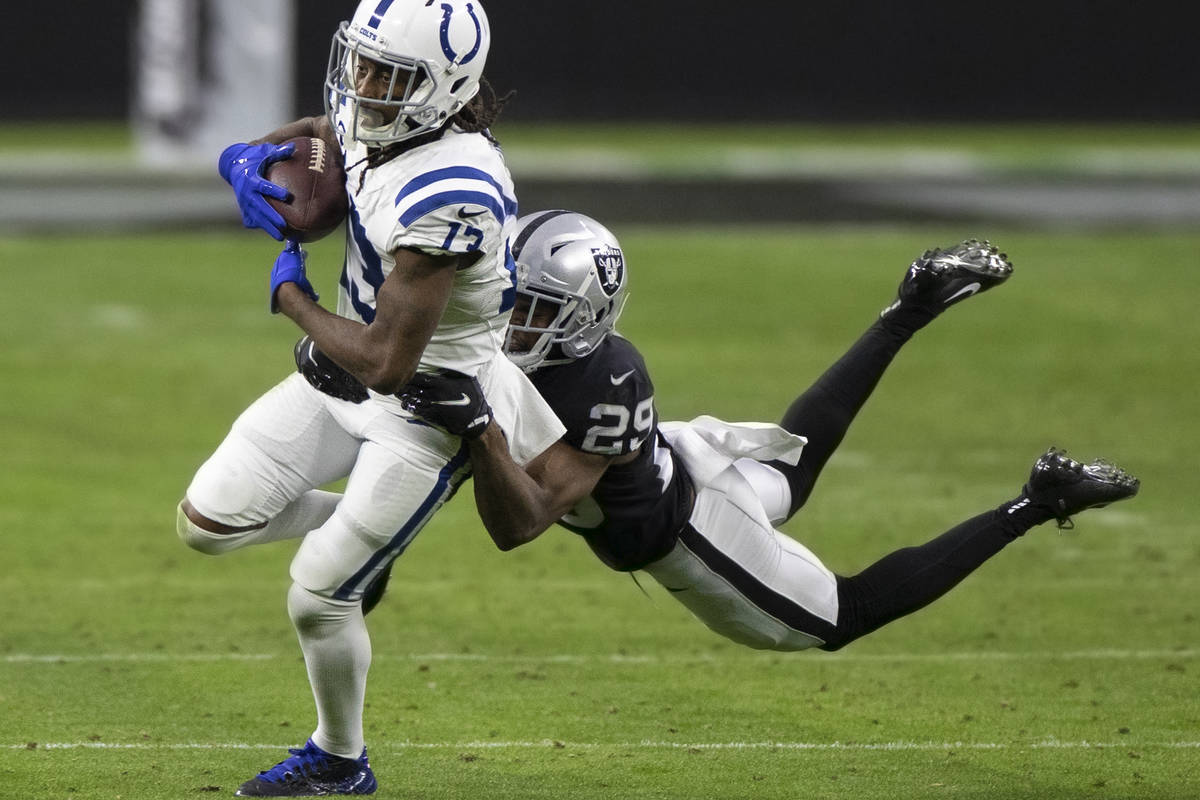 Indianapolis Colts wide receiver T.Y. Hilton (13) makes a catch with Raiders free safety Lamarc ...