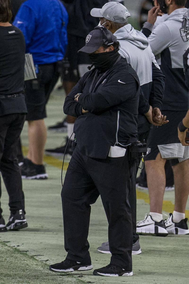 Raiders defensive coordinator Paul Guenther looks down during the fourth quarter of an NFL foot ...