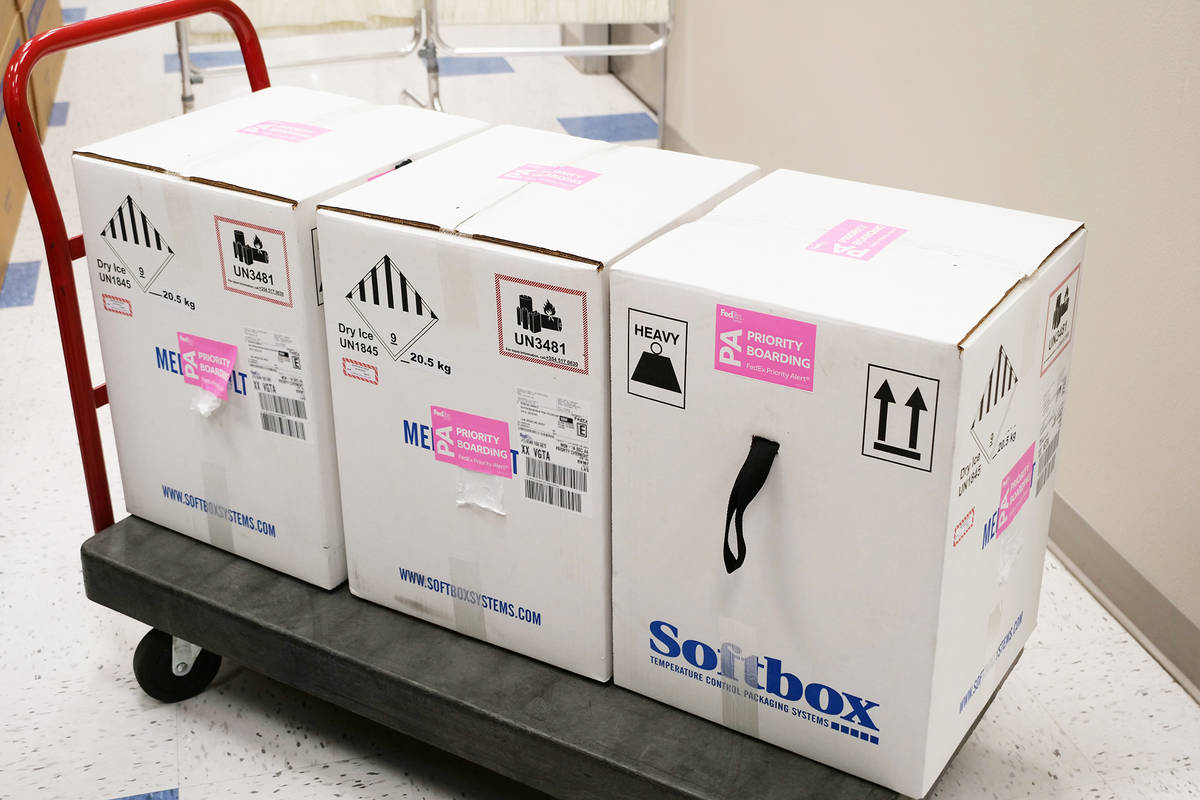 The first doses of COVID-19 vaccine arrive at the Southern Nevada Health District on Monday, De ...
